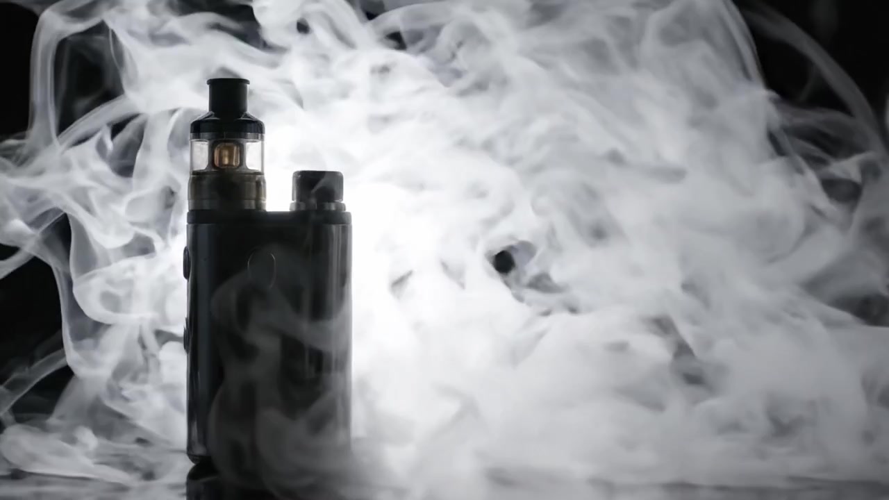 A Modern Vaping Device Producing Dense Clouds of Vapor Against a Dark Background, Capturing the Essence of Contemporary Smoke Culture and Personal Enjoyment