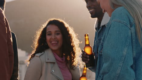 group-of-diverse-friends-hanging-out-dancing-together-enjoying-rooftop-party-at-sunset-drinking-alcohol-having-fun-on-weekend-celebration