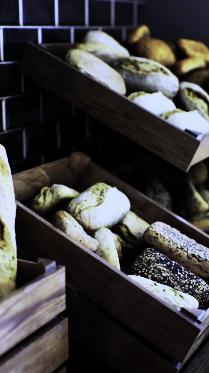 Freshly baked bread displayed in wooden crates at a cozy bakery