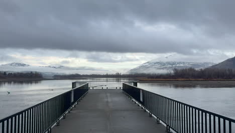 a peaceful platform view over the thompson river in kamloops