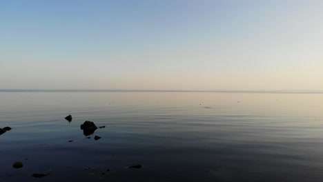 calm serene tranquil waters with rocks poking through