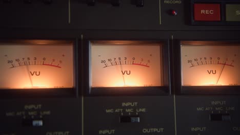 close up shot of the vu meters on a vintage tape recorder in the recording studio