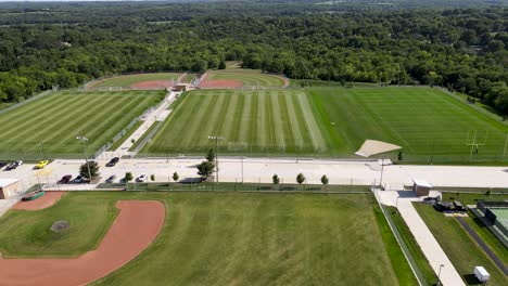 sports fields - baseball diamond in grass landscape - aerial drone overhead view