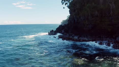 Beautiful-Panning-Drone-shot-with-the-Pacific-Ocean-waves-crashing-on-the-shore