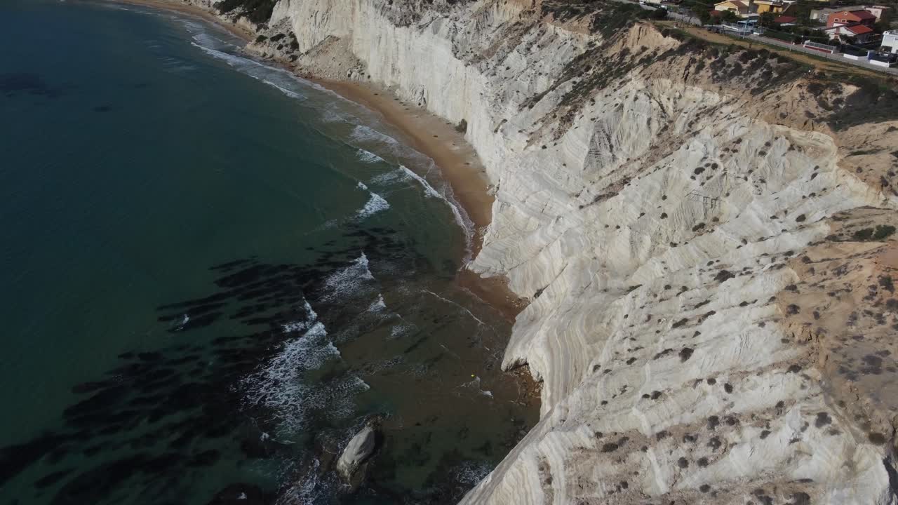 Fly Over White Cliffs and Waves Splashing on a Beach in the Meditteranean Sea
