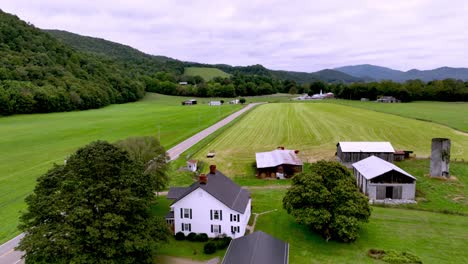 aerial pullout over farm and farmhouse in appalachia near mountain city tennessee