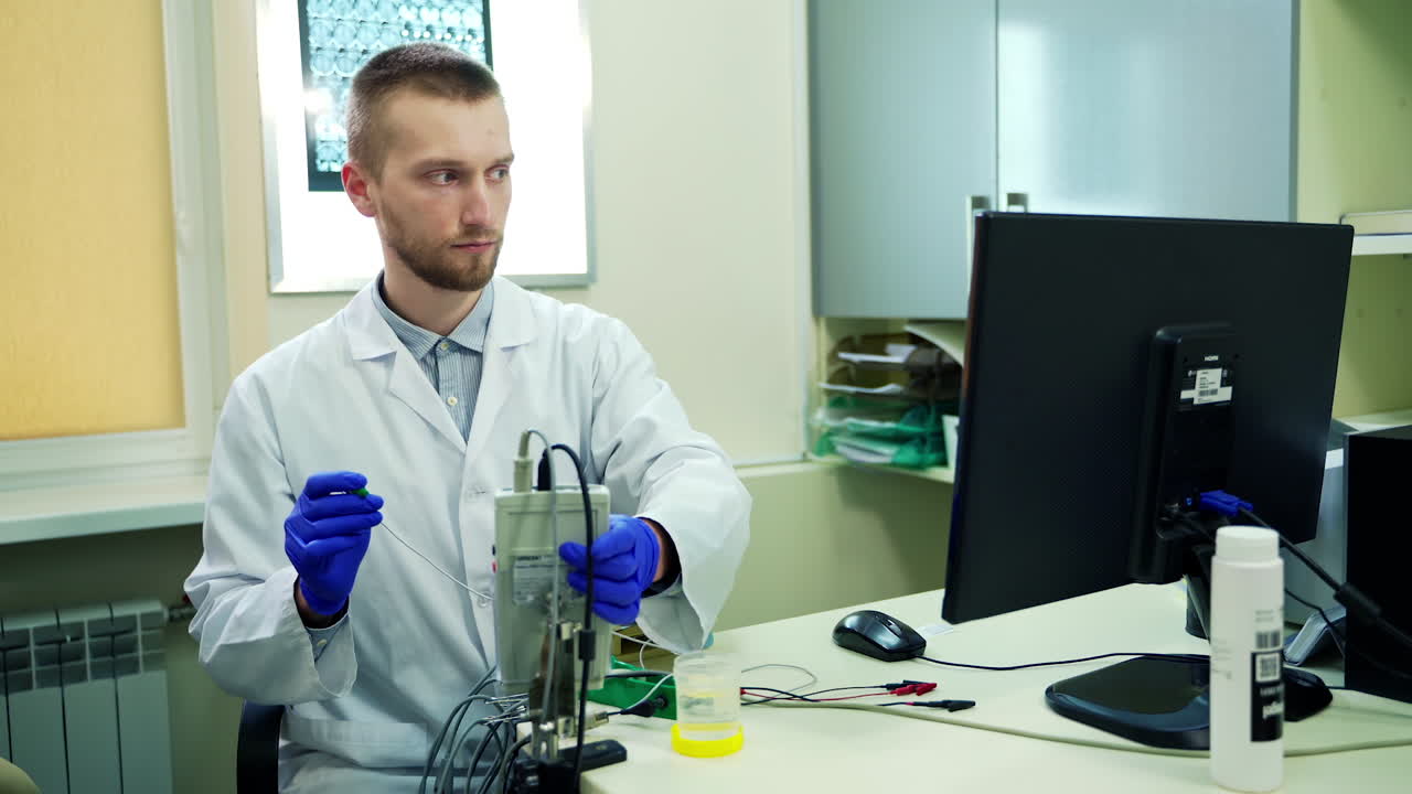 Doctor with medical equipment. Portrait of young doctor working with medical equipment
