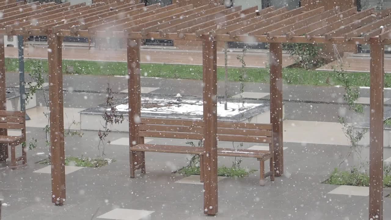Snowy Courtyard with Bench and Pergola