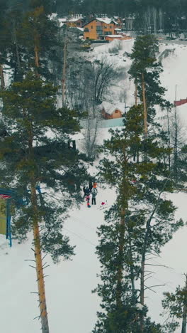skiers and snowboarders have fun on wide slopes covered with snow at popular big ski resort aerial view