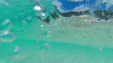 crystal clear wave breaking in slow motion at little beach in two peoples bay, albany western australia 4