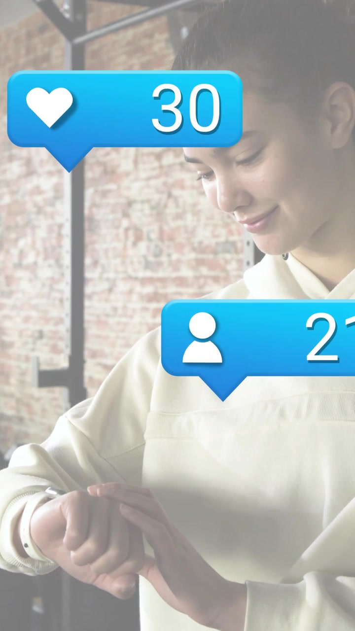 Vertical video: Woman tapping watch in studio, causing social bubbles to increment, showing growth