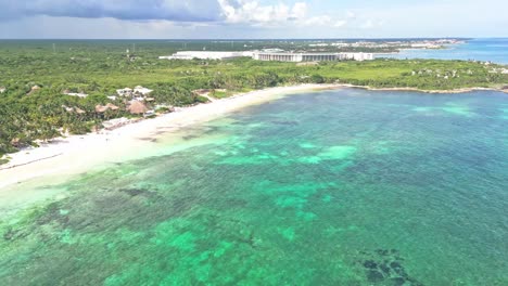 aerial view of xpu-ha beach, mexico, with clear water, lush coast