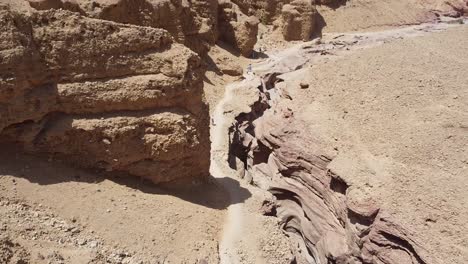 Drone-shot-flying-over-the-red-canyon-in-Eilat