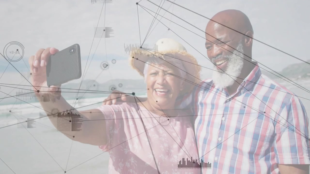 Couple stepping on beach framing smartphone selfie, capturing moment with tech data network overlay