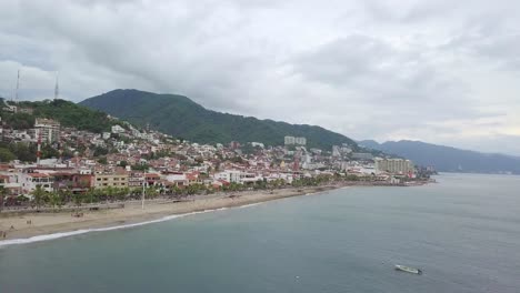 Aerial-view-of-Malecon-Puerto-Vallarta,-Mexican-beach-promenade-on-cloudy-day