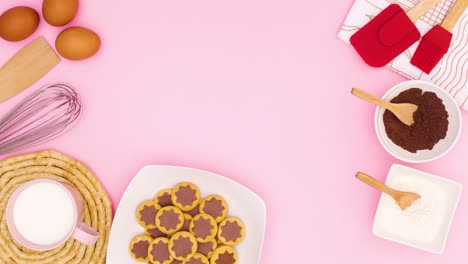 cookies in plate and items for baking move in corner of pink theme. stop motion