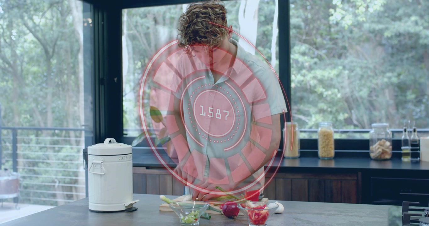 Home cook chopping veggies in smart kitchen after HUD activation and tracking slicing precision