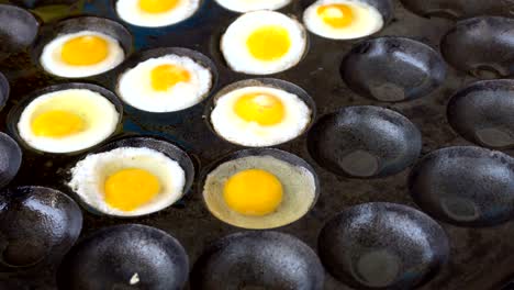 kind of thai sweetmeat with quail eggs on traditional pan