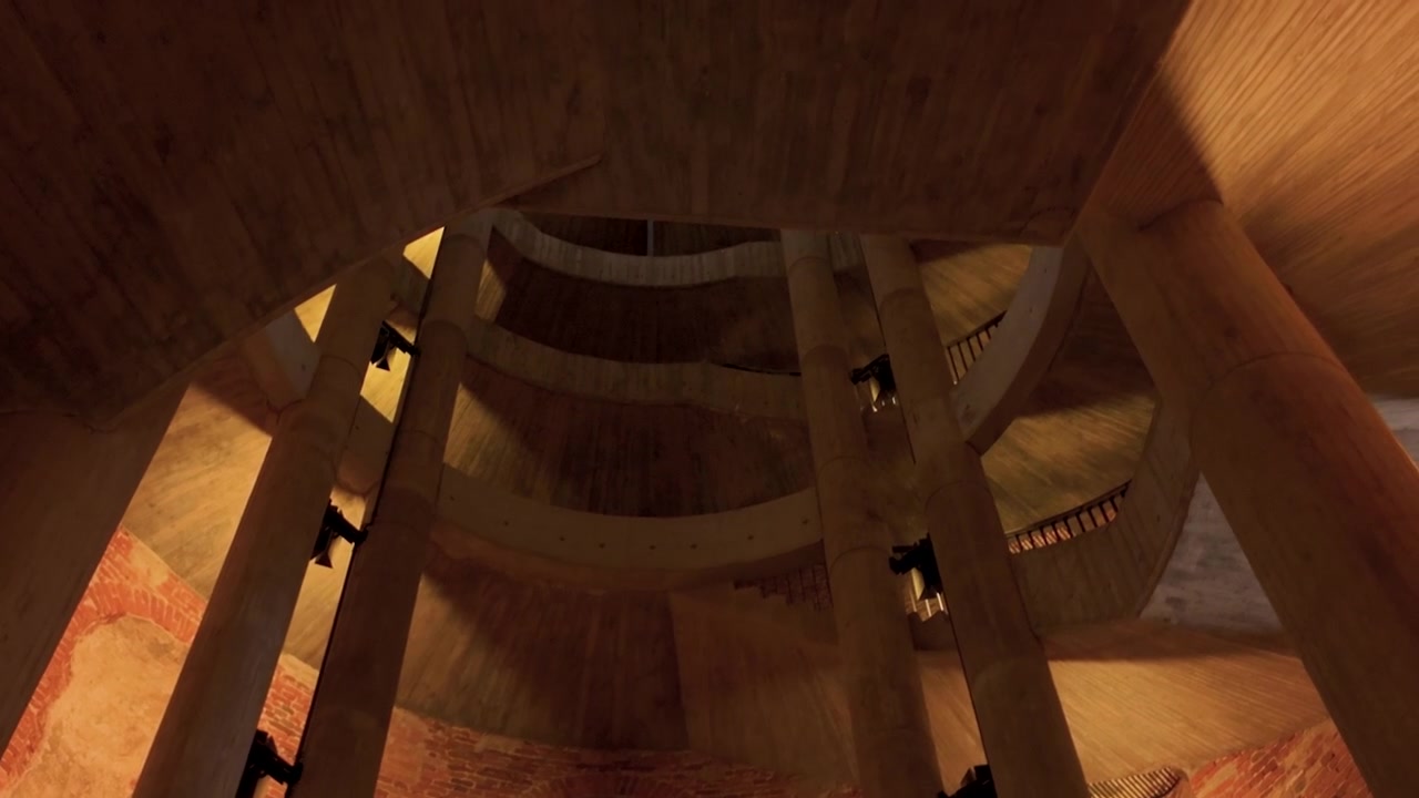Intérieur circulaire à plusieurs niveaux d'un bâtiment industriel moderne avec des piliers en béton apparent