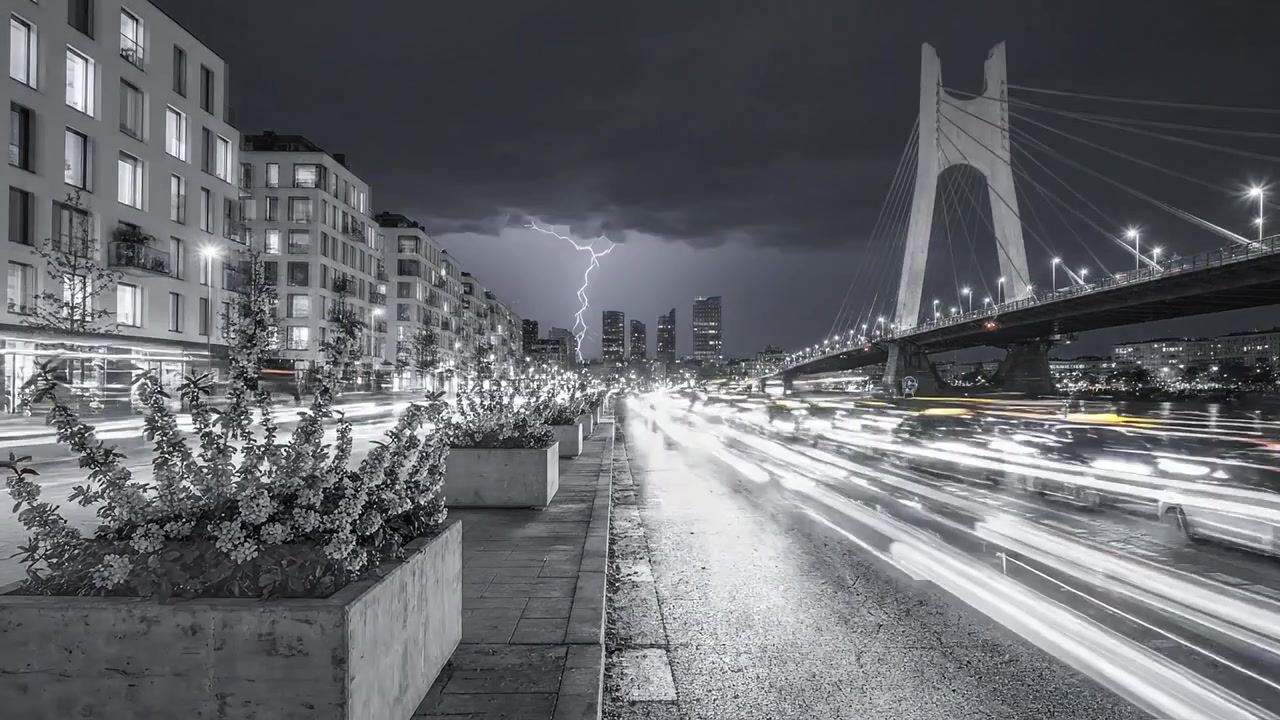 A Stunning Urban Landscape Captured in Black and White, Showcasing a Bridge, Lightning, Traffic, and a Dramatic Sky Over a Vibrant City Scene