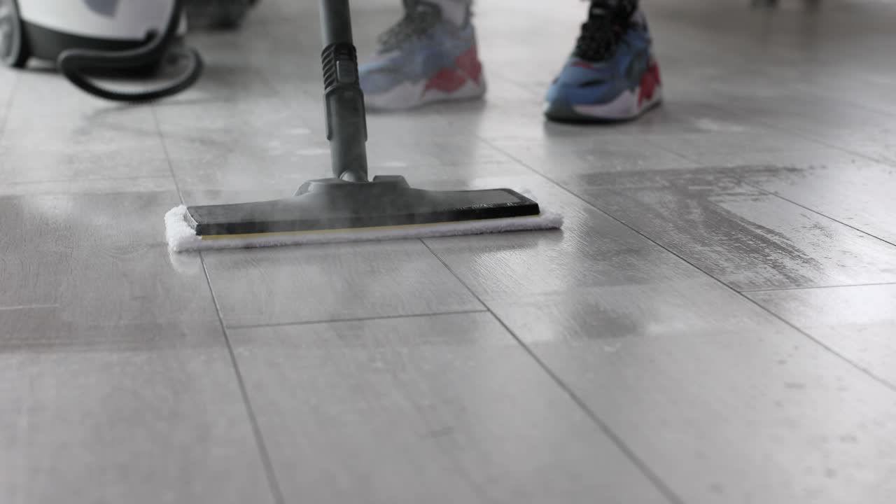 Powerful steam mop cleans dirty kitchen floor tiles fast