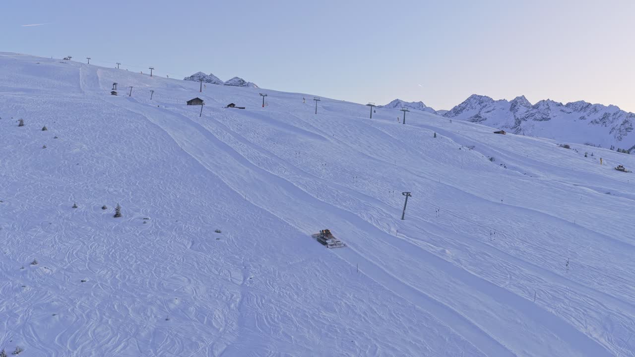 Drone perspective capturing Königsleiten and Krimml with ski lifts, snowy slopes, and panoramic alpine winter views