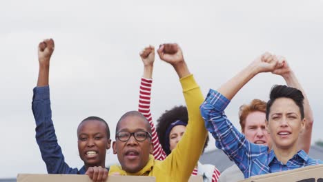 Diverse-group-of-protesters-with-raised-hands-sceaming