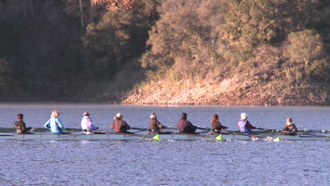 panning of an eight person rowing sweep on lake casitas in oak view california