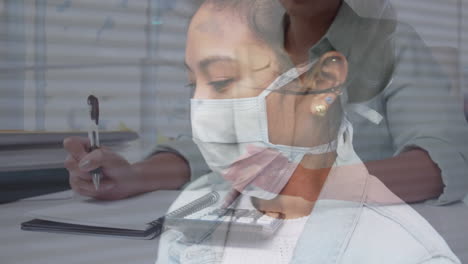 paperwork and calculator over woman with mask.