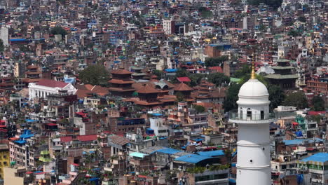 white tower dharahara, kathmandu durbar square, urbanization, unmanaged architectural buildings, modern city, trees, drone shot 4k