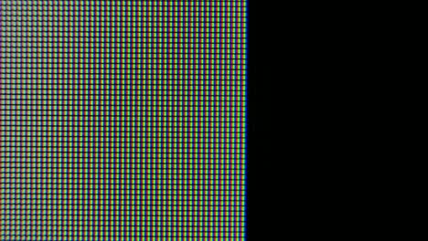 pixels zoomed in with red, blue, and green glowing crystals and patterns on a computer graphics monitor. pixels appear and then disappear on the screen