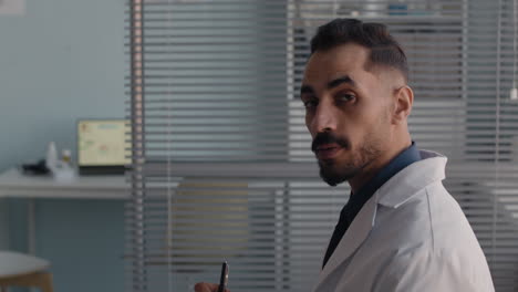 doctor writing on tablet