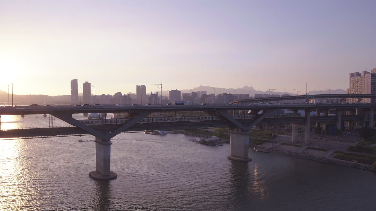 A panoramic view of the Hangang Bridge crossing the bridge with subway and car
