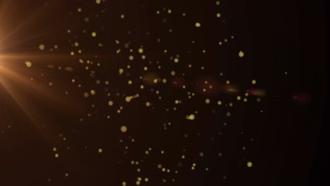 animación de puntos dorados que se mueven sobre un fondo negro