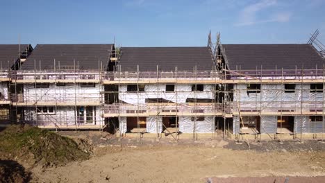 Houses-being-constructed-with-scaffolding-and-foil-insulation-material