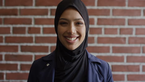 portrait happy young muslim woman smiling enjoying successful independent lifestyle mixed race female wearing hijab headscarf slow motion