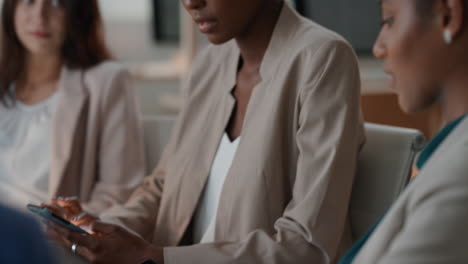 diverse business people using digital tablet computers browsing financial graph information on screen colleagues brainstorming ideas in office meeting