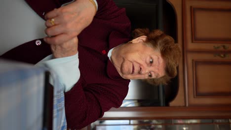 static medium shot of a caucasian old lady sitting and telling a story
