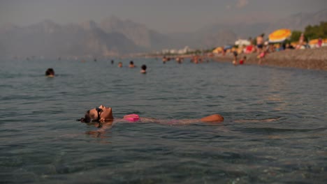 woman relaxing in the sea at a beach resort
