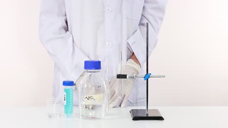 scientist conducts naoh reaction in laboratory setting