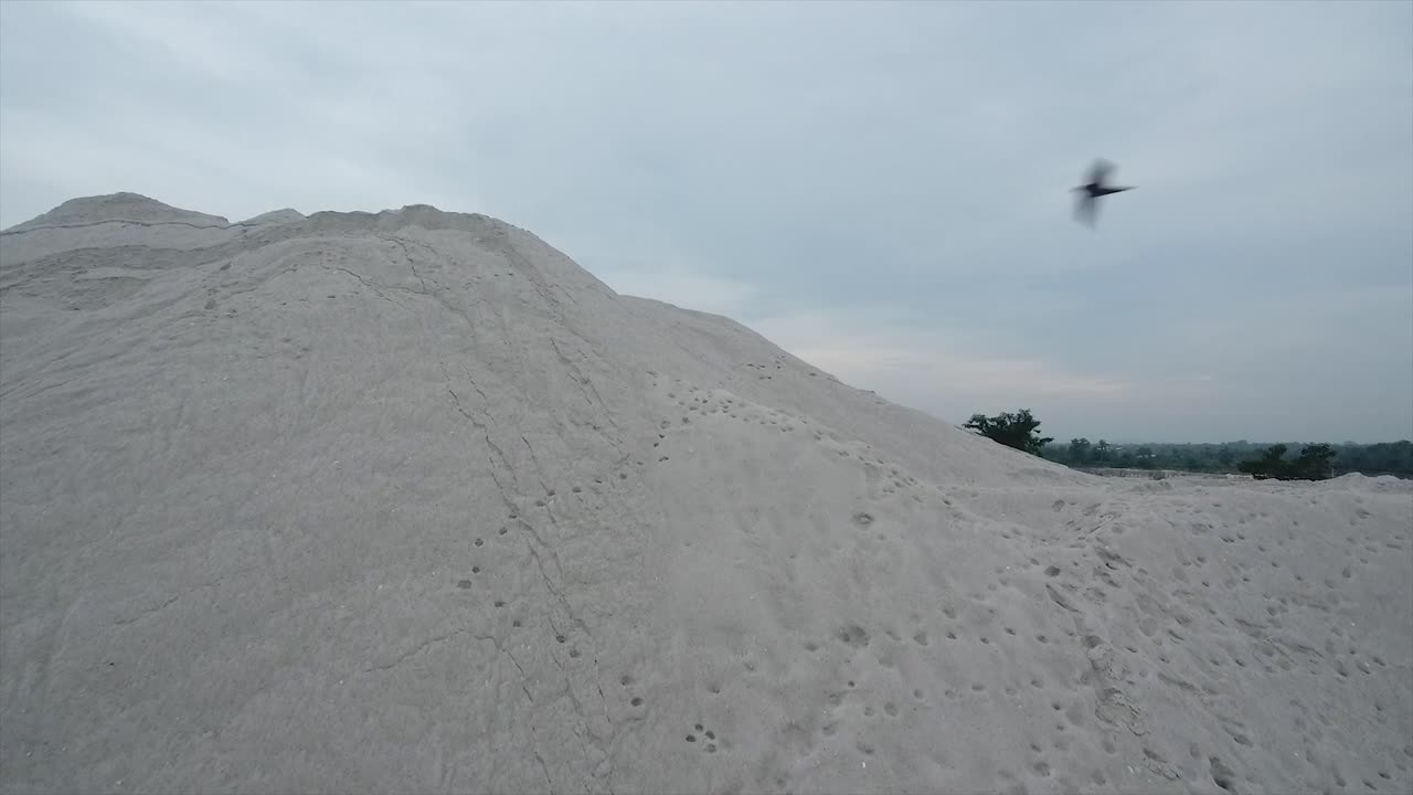 stretch of white sand mines visible from above and form like a mountain