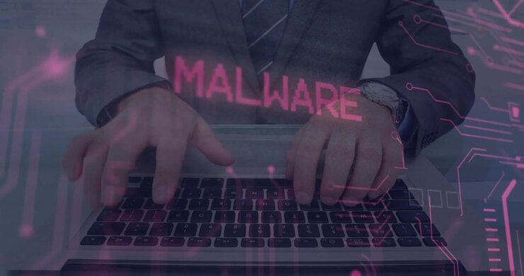 Man in suit typing on keyboard, starting security HUD spelling MALWARE, neon bits alerting IT