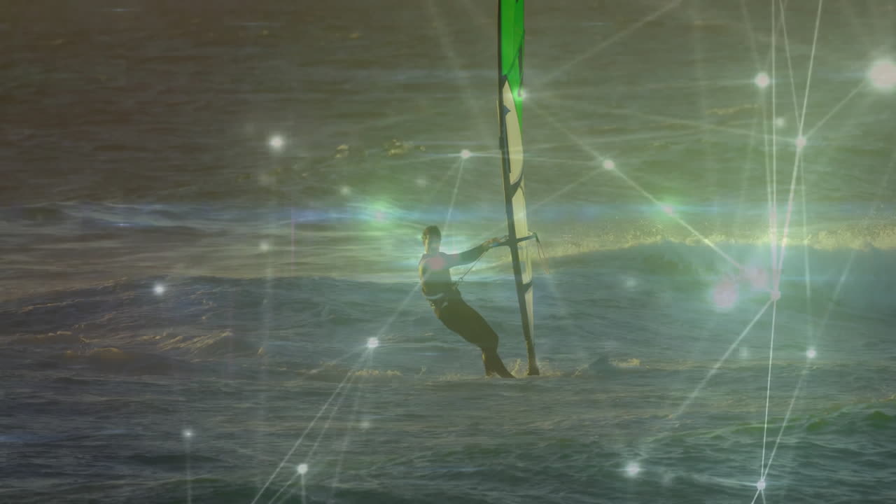 Man windsurfing on golden ocean waves with glowing network nodes illustrating technology connection