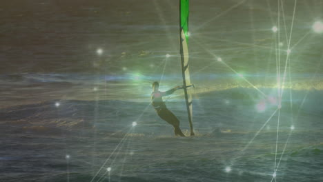 man windsurfing on golden ocean waves with glowing network nodes illustrating technology connection