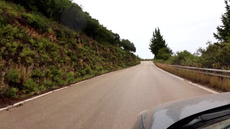 moody overcast day capturing lush green countryside mountains of ithaca, greece