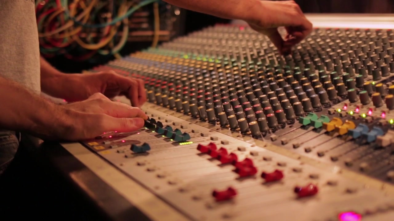 Sound Engineers Operating Audio Mixer on a Concert