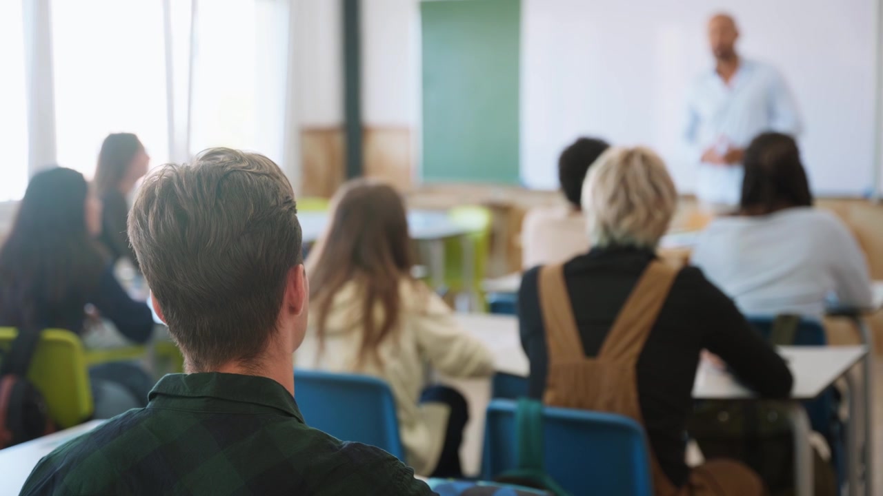 Students Listening to Teacher in Classroom