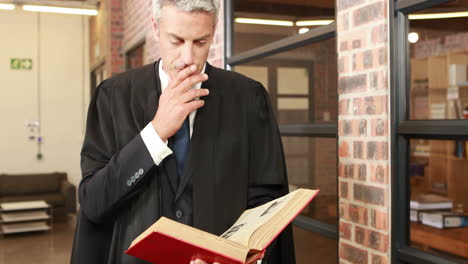 mature magistrate reading book