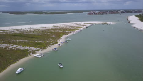 drone shot of an island in marco island, florida with boats on shore