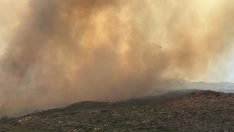 Fire-fighting-helicopters-working-on-fire